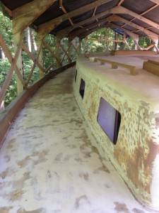 Finally the decks are smooth, the core is dry. You can see here that the teak covering the cabin-top sides has been removed and the surface faired.