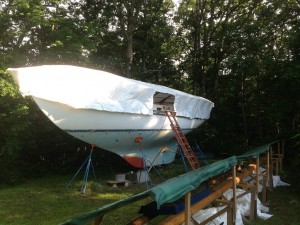 A new white tarp replaced the green tarp that covered only the top of the frame.