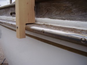 Here you can see one of the frame sections attached to the rub-rail.  With this arrangement, there was no interference with the deck or any of the hardware, including stanchions.