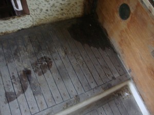 The poor condition of the teak in the cockpit.