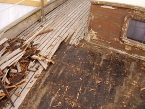 This is a view from the forward deck looking aft (and starboard).  This picture shows the terrible condition of the cabin house, which was eventually stripped and varnished bright.